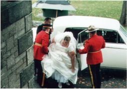 Andrea's dad and brother help her out of the car
